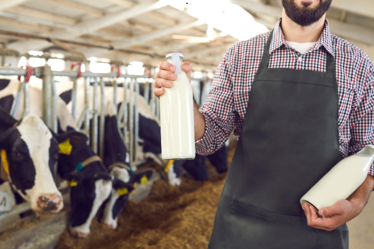 man holding milk bottle